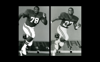 Two individuals are in mid-action poses, wearing football uniforms with the numbers 78 and 27. They are on a field, and the background shows part of a stadium with "ALABAMA" visible. The image is in black and white.